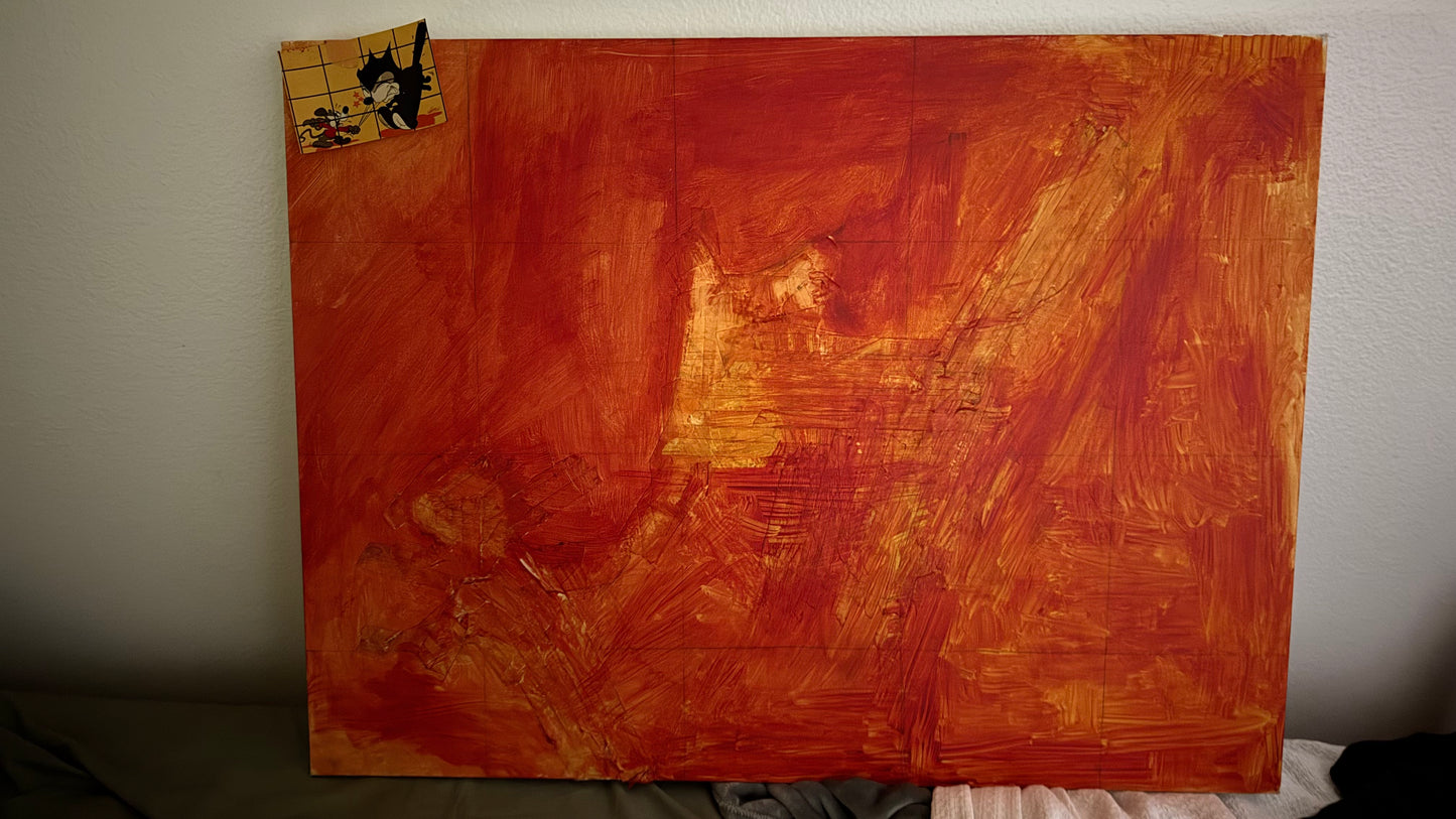 An abstract painting on a canvas board, featuring textured brushstrokes of orange, red, and yellow, leaning against a light gray wall.